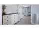 Hallway with a decorative dresser that leads to the living area at 2496 E Lindrick Dr, Gilbert, AZ 85298