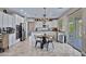 Spacious kitchen boasts stainless appliances, granite counters, central island and cozy table at 2496 E Lindrick Dr, Gilbert, AZ 85298