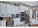Bright kitchen featuring stainless steel appliances, granite counters, and built in coffee bar at 2496 E Lindrick Dr, Gilbert, AZ 85298
