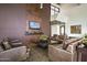 Cozy lobby space features leather seating, a TV, and stylish decor that exudes a welcoming atmosphere at 2496 E Lindrick Dr, Gilbert, AZ 85298