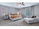 Main bedroom suite with a sitting area, bedside table, and window at 2496 E Lindrick Dr, Gilbert, AZ 85298