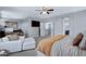 Spacious main bedroom with a cozy sitting area and television at 2496 E Lindrick Dr, Gilbert, AZ 85298