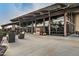 Spacious covered patio with fireplace and community lake views at 2496 E Lindrick Dr, Gilbert, AZ 85298