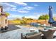 Inviting backyard with a sparkling pool, waterfall feature, comfortable lounge chairs, and lush landscaping at 2607 W Gray Wolf Trl, Phoenix, AZ 85085