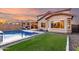 Expansive backyard featuring a sparkling pool with a waterfall feature, perfect for outdoor living and entertaining at 2607 W Gray Wolf Trl, Phoenix, AZ 85085