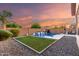 Lush backyard with a refreshing pool, tranquil waterfall, and meticulously maintained landscaping for ultimate relaxation at 2607 W Gray Wolf Trl, Phoenix, AZ 85085