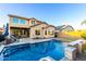 Beautiful two-story home showcasing a sparkling pool, serene waterfall, and ample backyard space for outdoor enjoyment at 2607 W Gray Wolf Trl, Phoenix, AZ 85085