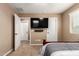 Cozy bedroom featuring a wall mounted TV and neutral-toned walls at 2607 W Gray Wolf Trl, Phoenix, AZ 85085