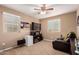 Bedroom with carpet, ceiling fan, television, and chair at 2607 W Gray Wolf Trl, Phoenix, AZ 85085