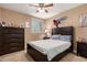 Bedroom with carpet, ceiling fan, and a dresser at 2607 W Gray Wolf Trl, Phoenix, AZ 85085