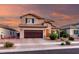 Beautiful home with desert landscaping, complemented by a brown garage door and warm exterior tones at 2607 W Gray Wolf Trl, Phoenix, AZ 85085
