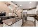 Modern kitchen with granite countertops, stainless steel appliances, and an open view to the living area at 2607 W Gray Wolf Trl, Phoenix, AZ 85085