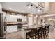 Stylish kitchen featuring granite countertops, white cabinets, stainless appliances, and an island with bar seating at 2607 W Gray Wolf Trl, Phoenix, AZ 85085