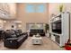 Open-concept living room with high ceilings, clerestory windows, and comfortable seating at 2607 W Gray Wolf Trl, Phoenix, AZ 85085