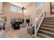 Spacious living room featuring soaring ceilings, clerestory windows, and comfortable seating at 2607 W Gray Wolf Trl, Phoenix, AZ 85085