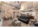 Bright living room with high ceilings, staircase, modern furniture, and open floor plan at 2607 W Gray Wolf Trl, Phoenix, AZ 85085