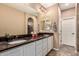 Main bathroom with double sinks, granite countertops, and tile floors at 2607 W Gray Wolf Trl, Phoenix, AZ 85085