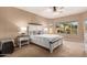 Relaxing main bedroom with decorative bed, neutral tones, and bright natural light at 2607 W Gray Wolf Trl, Phoenix, AZ 85085