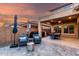 Relaxing outdoor patio area with comfortable seating and a dining table, perfect for entertaining at 2607 W Gray Wolf Trl, Phoenix, AZ 85085