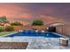 Serene backyard pool area with a striking waterfall, ideal for relaxation and enjoying the outdoors at 2607 W Gray Wolf Trl, Phoenix, AZ 85085