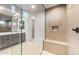 Modern bathroom featuring a walk-in shower, stylish vanity with sink, and neutral color palette at 26914 W Renee Dr, Buckeye, AZ 85396