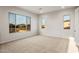 Spacious bedroom has carpet flooring, neutral walls, and large windows with neighborhood views at 26914 W Renee Dr, Buckeye, AZ 85396