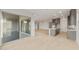 View of the kitchen from the bright living room that features light wood floors, large windows and lots of space at 26914 W Renee Dr, Buckeye, AZ 85396
