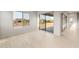 Light filled living area has light wood floors, large windows, and sliding doors for seamless indoor/outdoor living at 26914 W Renee Dr, Buckeye, AZ 85396