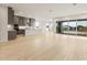 Open concept living area with a modern kitchen and a seamless transition to the outdoor space at 26914 W Renee Dr, Buckeye, AZ 85396