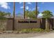 Dobbins Manor community entrance sign with desert landscaping and mountain views in the background at 2727 W La Mirada Dr, Laveen, AZ 85339