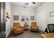 Bedroom featuring sitting area with two arm chairs and shuttered window at 27276 N 81St Ln, Peoria, AZ 85383