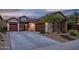 Charming single-Gathering home with a three-car garage, well-manicured lawn, and desert landscape at 27276 N 81St Ln, Peoria, AZ 85383