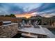 Outdoor fire pit with stone surround and seating, perfect for entertaining and relaxation at 27276 N 81St Ln, Peoria, AZ 85383