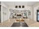 Open kitchen with stone countertops, modern sink and view to the living area at 27276 N 81St Ln, Peoria, AZ 85383