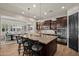 Well-appointed kitchen featuring a large island, granite countertops, and stainless steel appliances at 27276 N 81St Ln, Peoria, AZ 85383