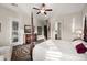 Cozy main bedroom with access to the backyard, soft carpet, and tv at 27276 N 81St Ln, Peoria, AZ 85383