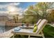 Backyard pool area with waterfall feature and lounge chairs at 27276 N 81St Ln, Peoria, AZ 85383