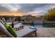Relaxing pool area with lounge chairs, side table with wine, and waterfall feature at 27276 N 81St Ln, Peoria, AZ 85383