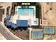 Aerial view of community pool, tennis courts, green space, and gathering spaces at 3114 S 155Th Ln, Goodyear, AZ 85338