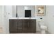 Bright bathroom featuring a double vanity with sleek cabinetry, quartz countertop, and modern fixtures at 3114 S 155Th Ln, Goodyear, AZ 85338