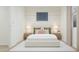 Serene bedroom showcasing a bed with decorative pillows, bedside tables, and soft, neutral decor at 3114 S 155Th Ln, Goodyear, AZ 85338