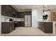 Modern kitchen with stainless steel appliances, dark cabinetry, and ample counter space, great for cooking at 3114 S 155Th Ln, Goodyear, AZ 85338