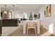 Well-lit living space with an open layout, combining the kitchen, dining, and living areas, ideal for modern living at 3114 S 155Th Ln, Goodyear, AZ 85338