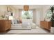 Comfortable main bedroom with a large window, side tables, and sophisticated decor, creating a peaceful retreat at 3114 S 155Th Ln, Goodyear, AZ 85338