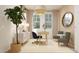 Inviting home office featuring a modern desk, comfortable seating, elegant lighting, and neutral decor at 3114 S 155Th Ln, Goodyear, AZ 85338