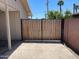 A wooden gate stands guard, providing security and privacy to the expansive backyard oasis at 3513 W Maryland Ave, Phoenix, AZ 85019