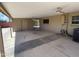 A covered back patio, showing the utility hookups and access to the house, plus ceiling fans at 3513 W Maryland Ave, Phoenix, AZ 85019