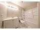 Clean bathroom with white fixtures, a vanity, and a shower-tub combination at 3513 W Maryland Ave, Phoenix, AZ 85019