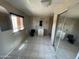 Full bathroom features a tiled floor, single sink vanity, and a shower stall at 3513 W Maryland Ave, Phoenix, AZ 85019