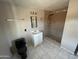 The bathroom features a tiled floor, sink, mirror, toilet, and a shower stall at 3513 W Maryland Ave, Phoenix, AZ 85019